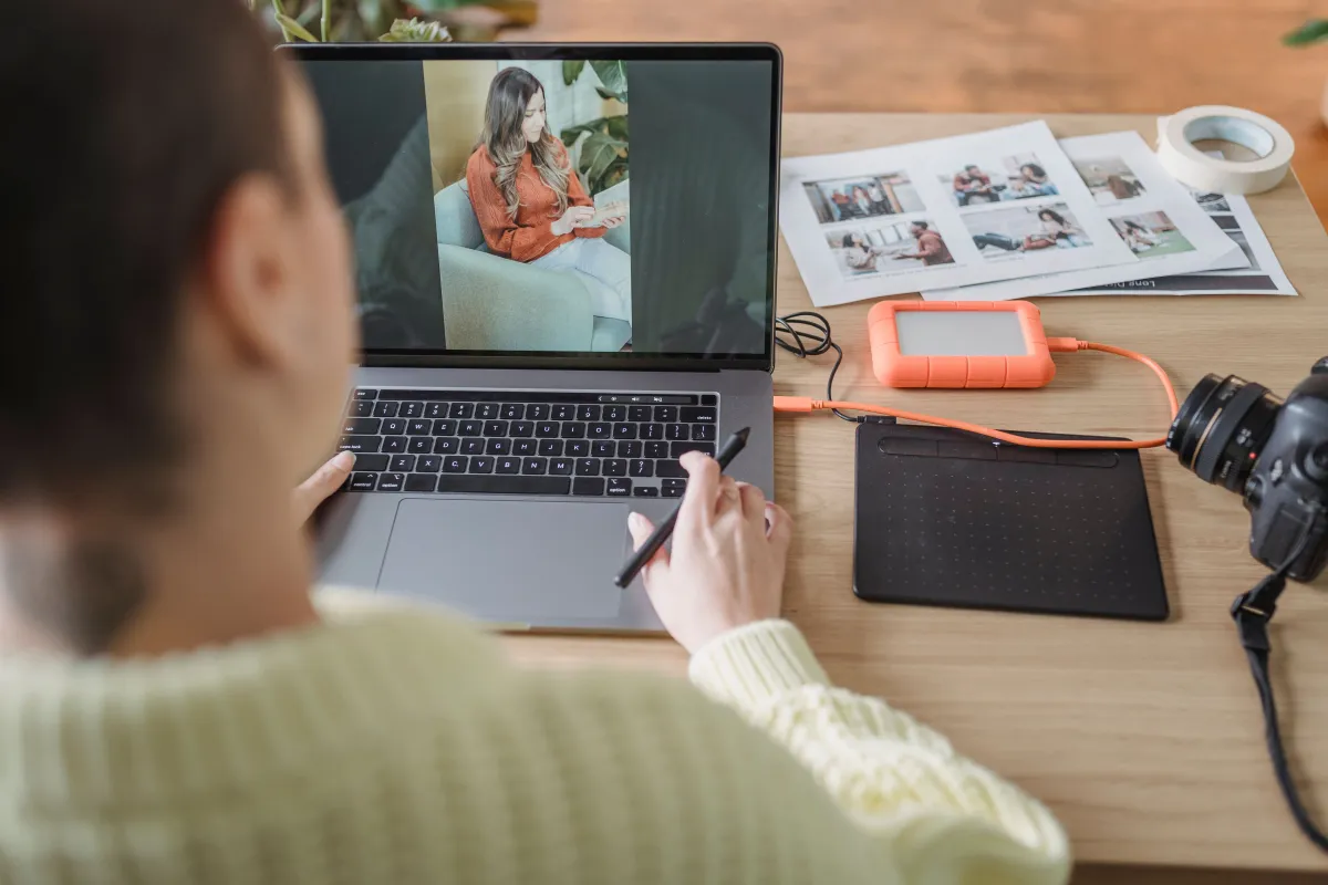 Photographer editing images on a computer