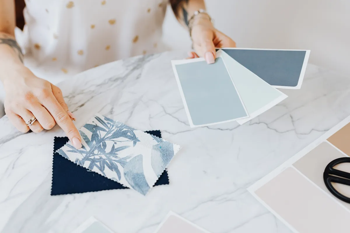 Designer choosing a color palette from swatches