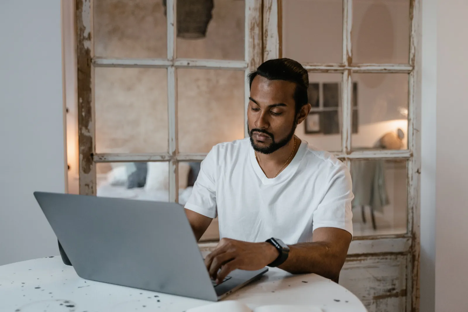 Freelancer working on a laptop at a minimal desk